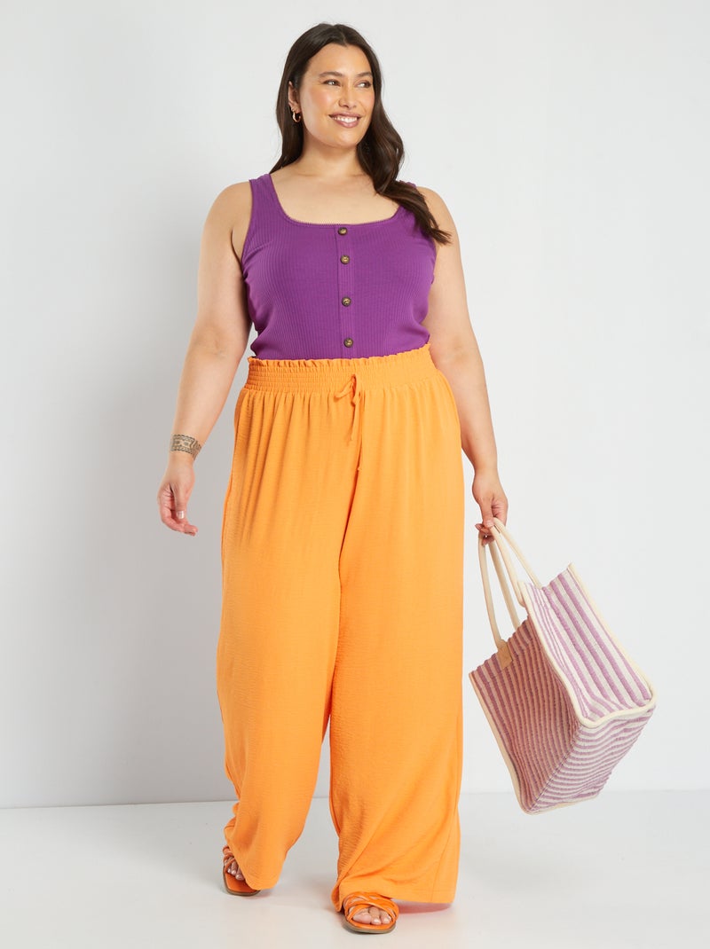 Calças fluidas em material crepe Laranja - Kiabi