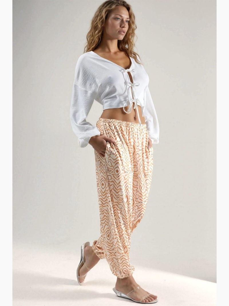 Calças jogger de cintura baixa com estampado zebra hiccup Bege - Kiabi