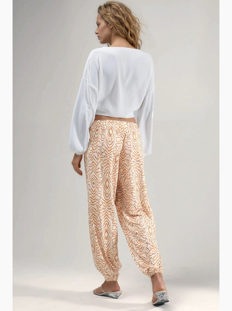 Calças jogger de cintura baixa com estampado zebra hiccup Bege - Kiabi