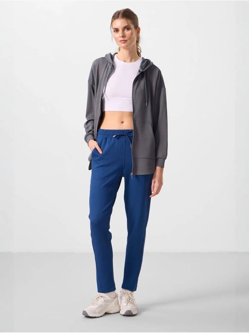 Calças jogger de mulher com fecho de correr tommy - Kiabi Calças jogger de mulher com fecho de correr tommy - Kiabi