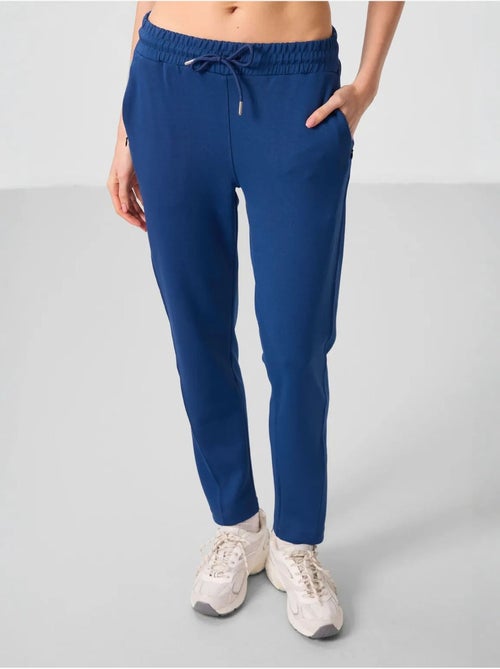 Calças jogger de mulher com fecho de correr tommy - Kiabi Calças jogger de mulher com fecho de correr tommy - Kiabi