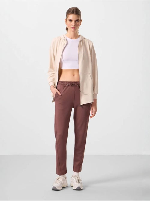 Calças jogger de mulher com fecho de correr tommy - Kiabi Calças jogger de mulher com fecho de correr tommy - Kiabi