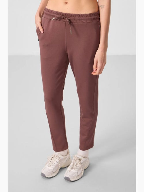 Calças jogger de mulher com fecho de correr tommy - Kiabi Calças jogger de mulher com fecho de correr tommy - Kiabi