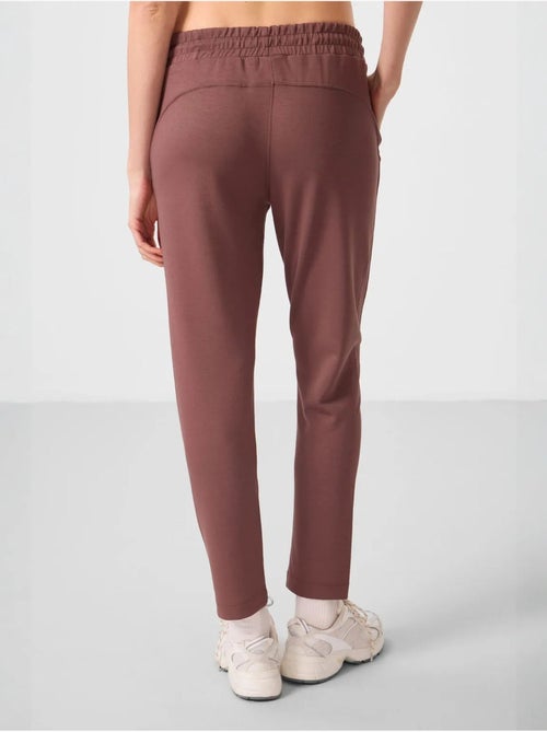 Calças jogger de mulher com fecho de correr tommy - Kiabi Calças jogger de mulher com fecho de correr tommy - Kiabi