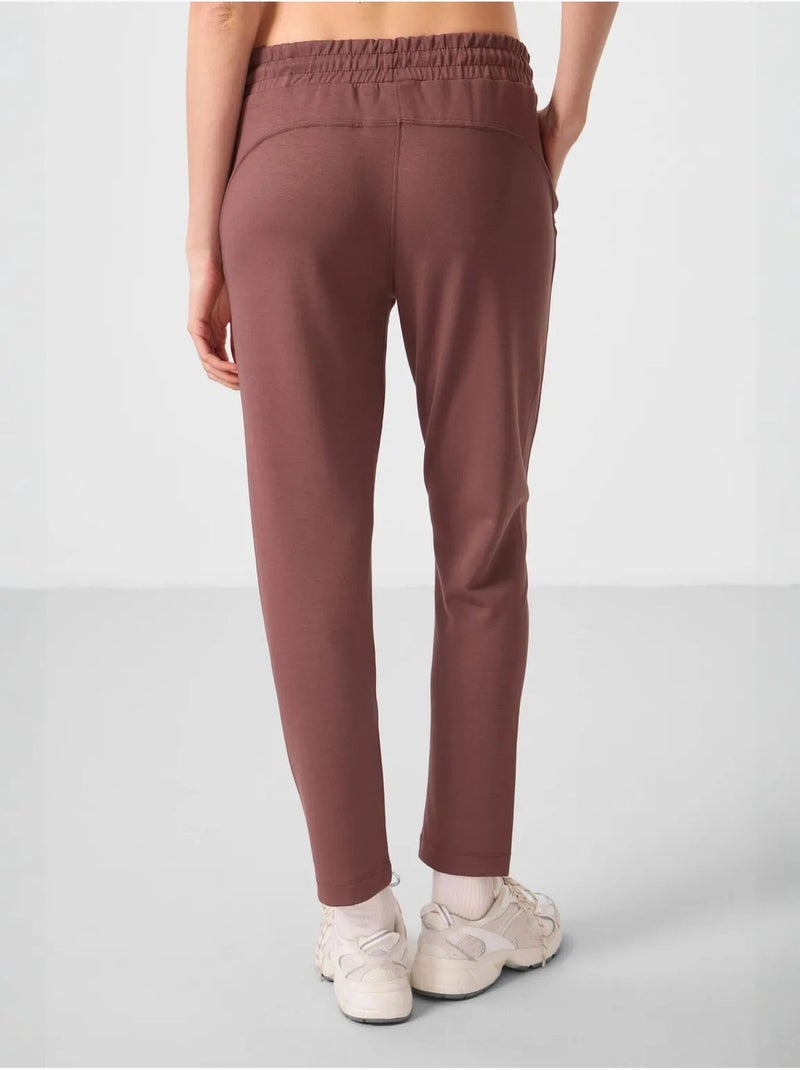 Calças jogger de mulher com fecho de correr tommy Castanho - Kiabi