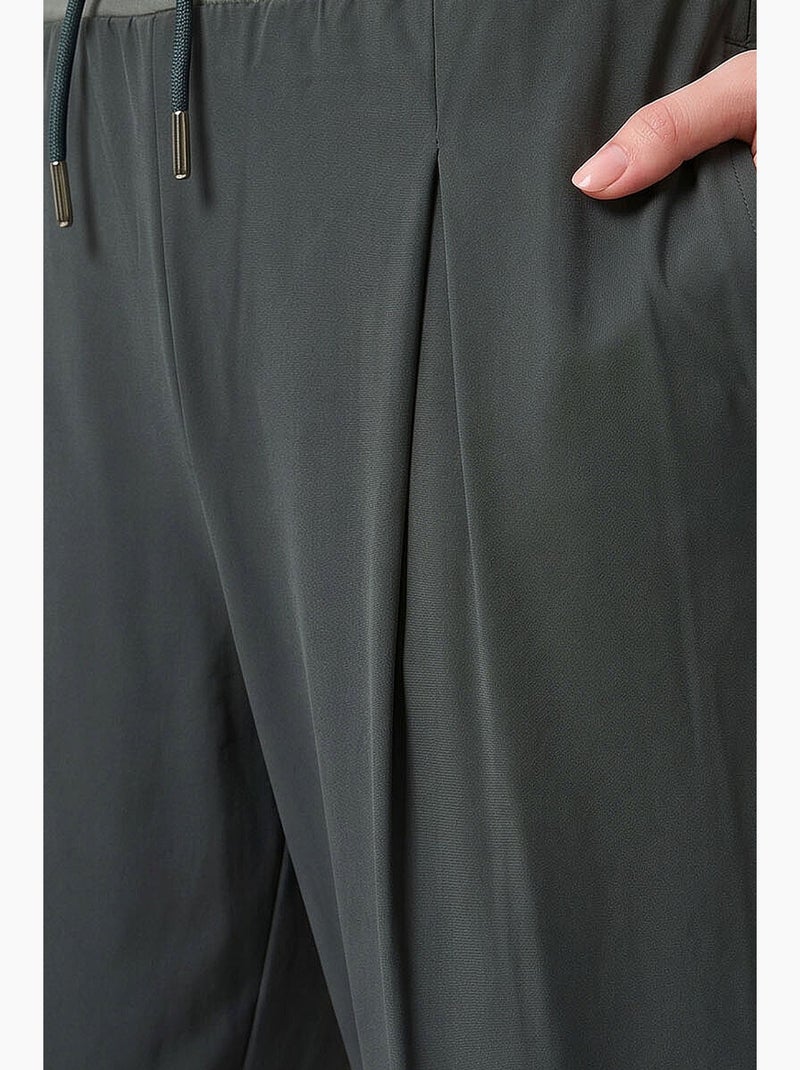 Calças jogger em jersey fino de cintura média com bolso tommy Cáqui - Kiabi