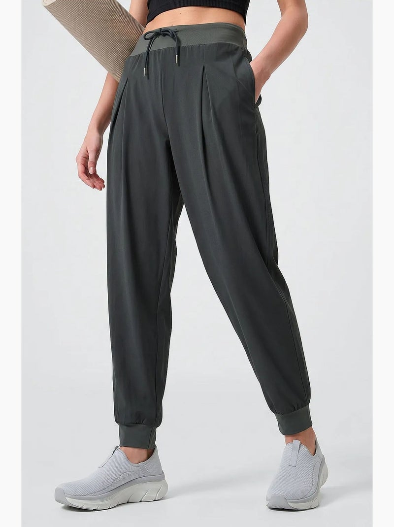 Calças jogger em jersey fino de cintura média com bolso tommy Cáqui - Kiabi