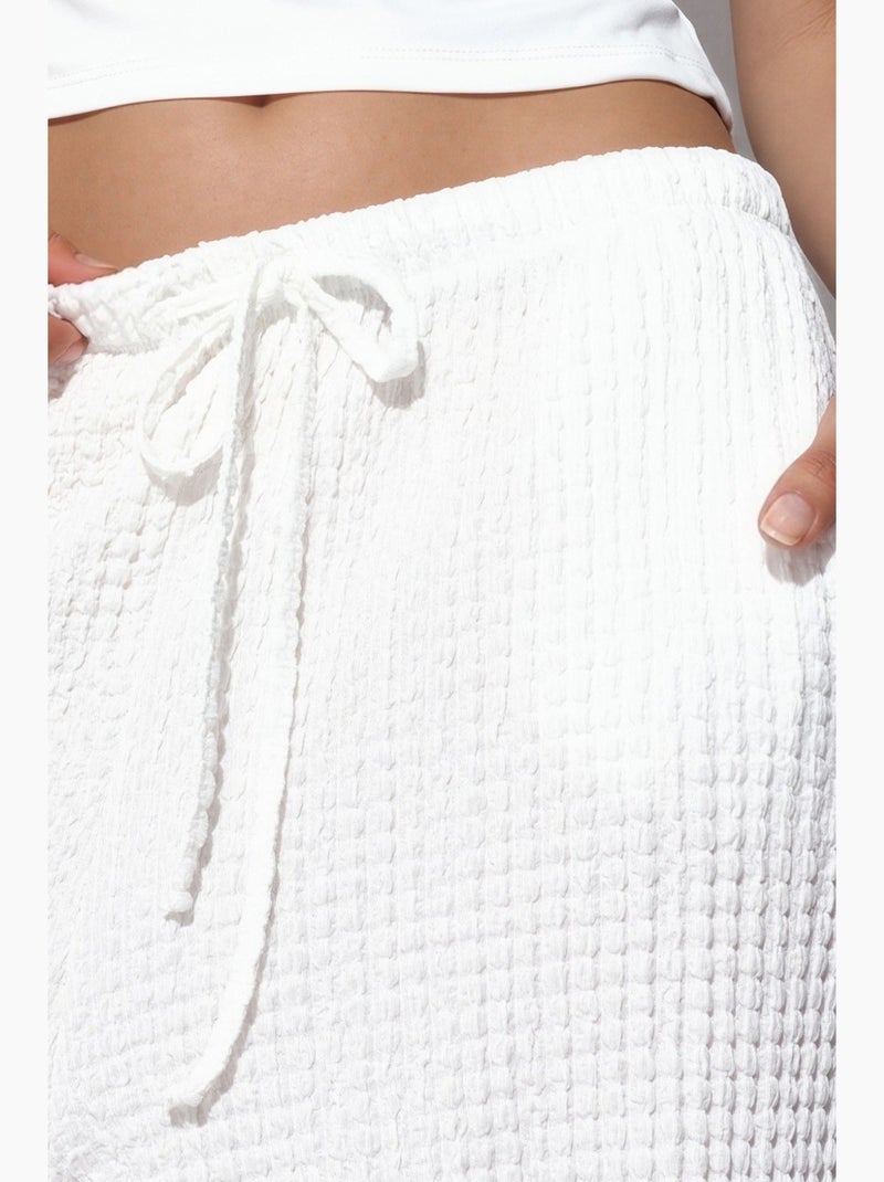 Calças jogger femininas em tecido busem Branco - Kiabi