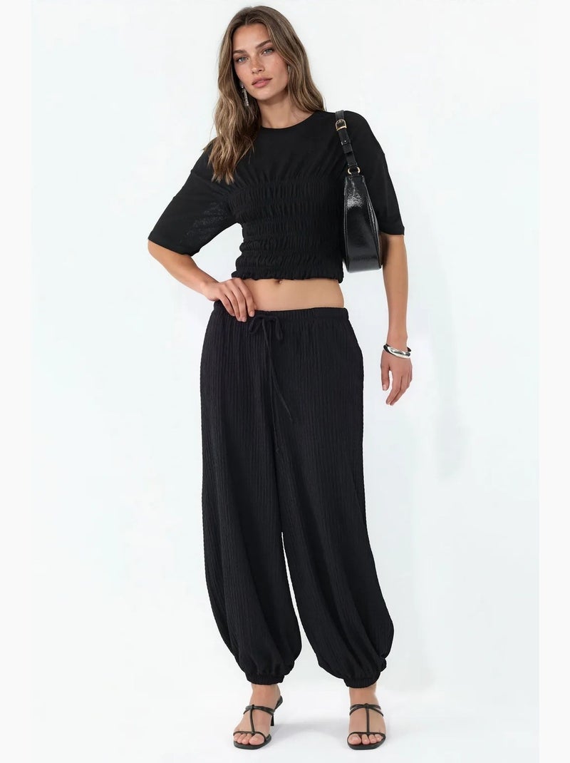 Calças jogger femininas em tecido busem Preto - Kiabi