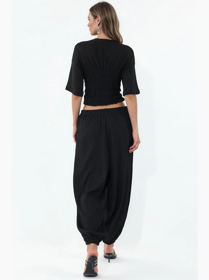 Calças jogger femininas em tecido busem Preto - Kiabi
