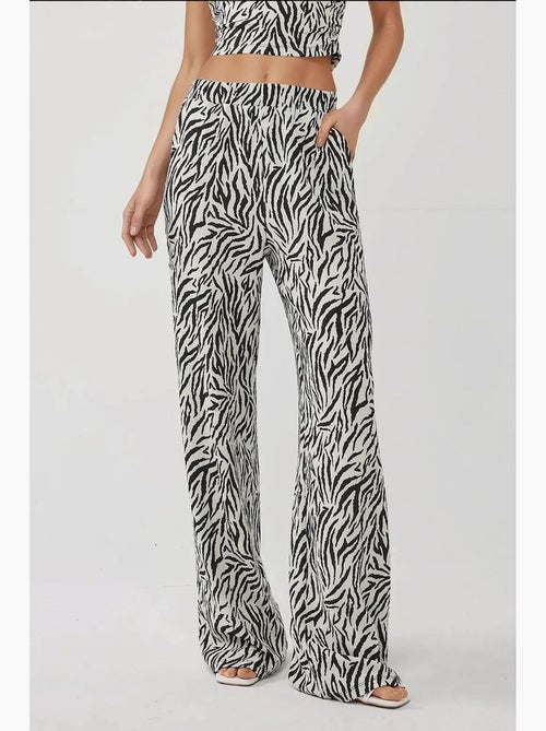 Calças largas com estampado de zebra hiccup - Kiabi Calças largas com estampado de zebra hiccup - Kiabi