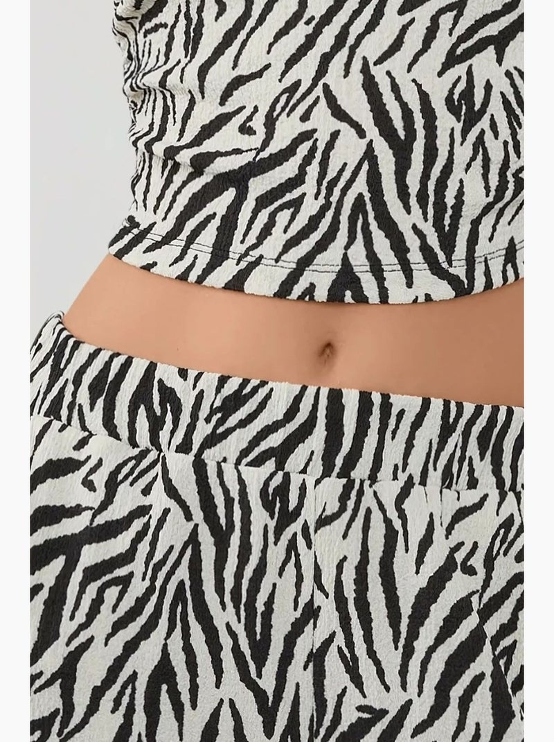 Calças largas com estampado de zebra hiccup Multicolorido - Kiabi