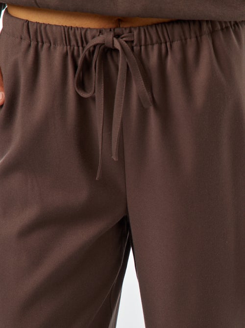 Calças largas com orla de lado - Kiabi