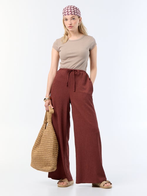 Calças largas crepe com 2 bolsos - Kiabi