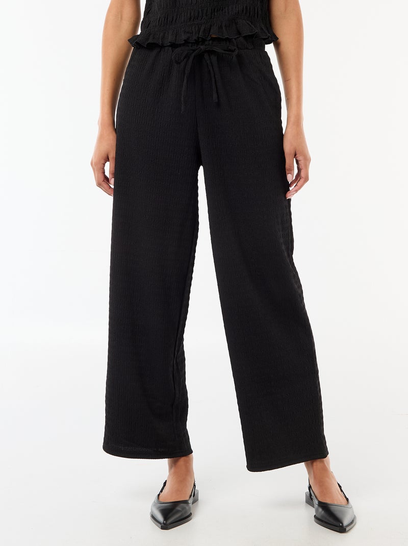 Calças largas de malha smockada Preto - Kiabi