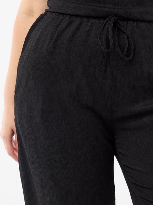 Calças largas em malha crepe - Kiabi