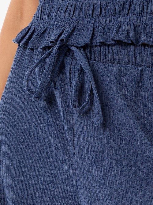 Calças largas em malha smock - Kiabi