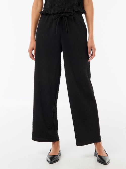 Calças largas em malha smock - Kiabi