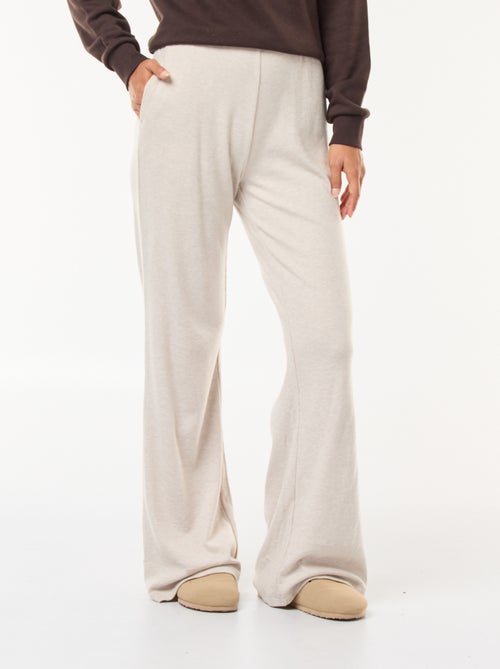 Calças largas em material canelado - Kiabi