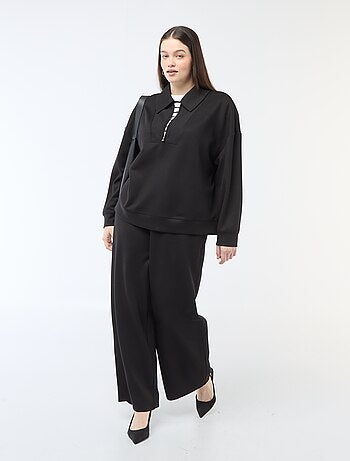 Calças largas em material stretch canelado