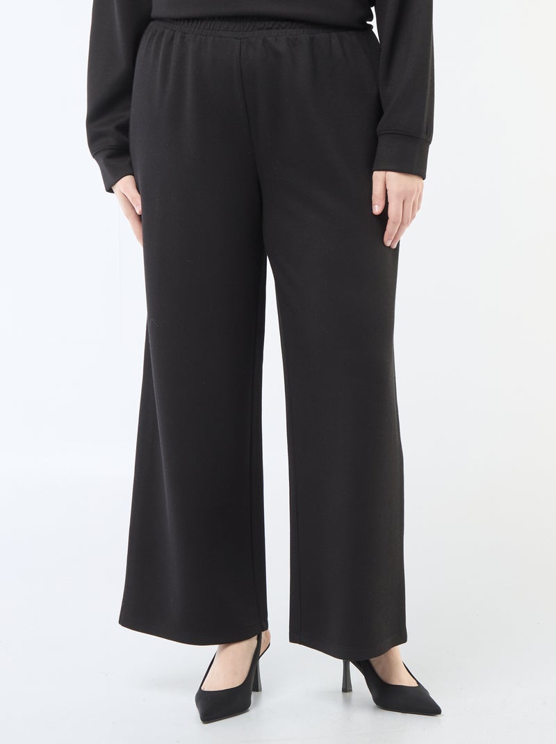 Calças largas em material stretch canelado Preto - Kiabi