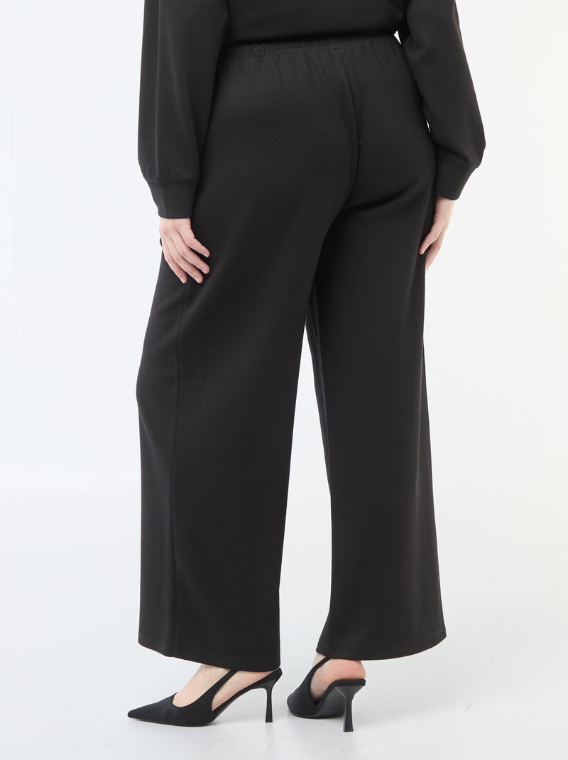 Calças largas em material stretch canelado Preto - Kiabi