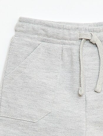 Calças relax em malha piqué