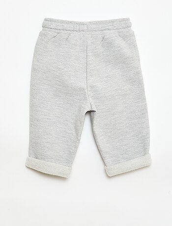 Calças relax em malha piqué