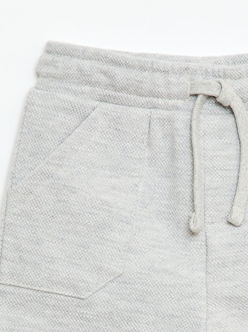 Calças relax em malha piqué - Kiabi