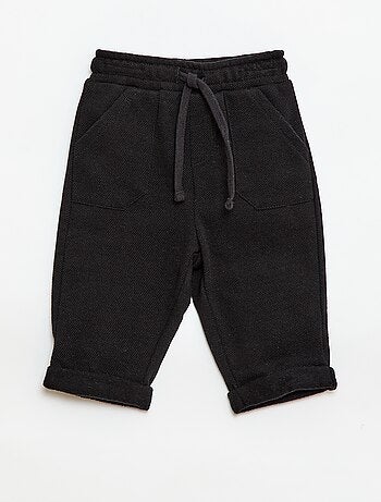 Calças relax em malha piqué