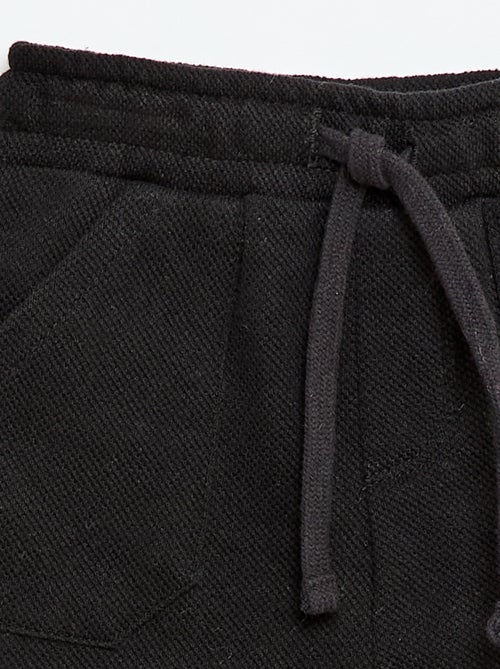 Calças relax em malha piqué - Kiabi