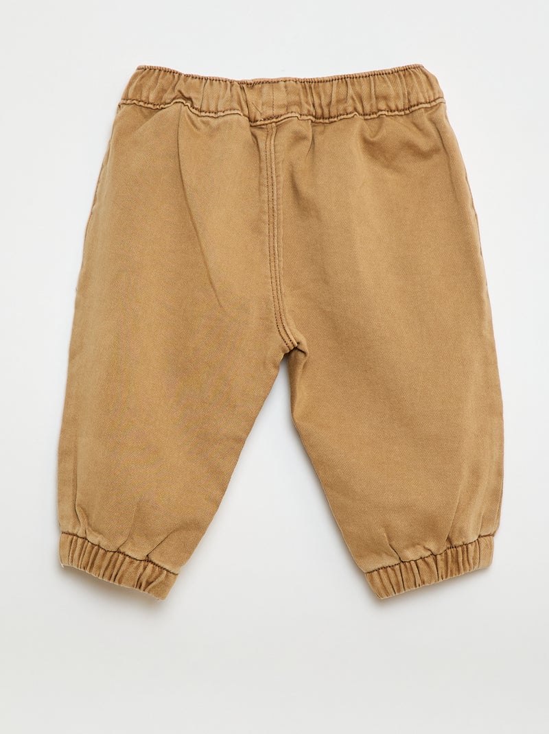 Calças relax fit Bege - Kiabi