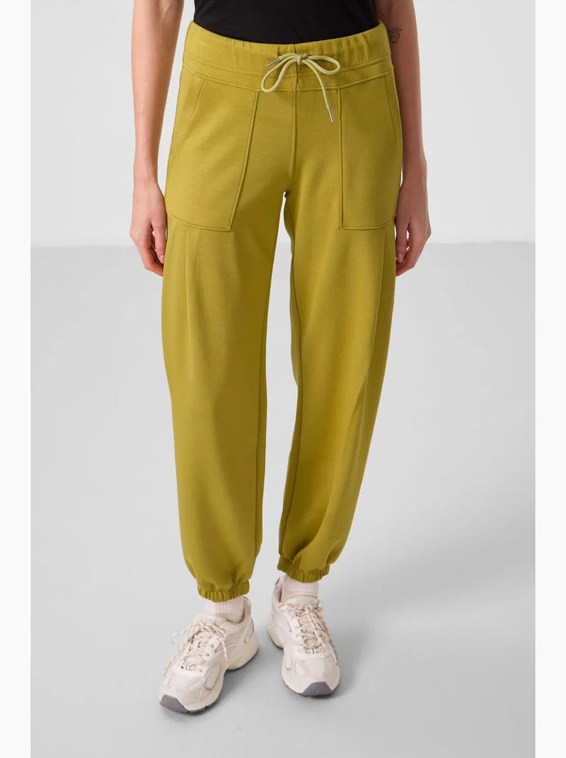 Calças relaxed de crepe de cintura média com bolso tommy Âmbar - Kiabi