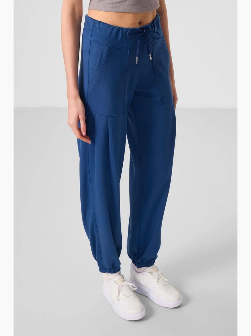 Calças relaxed de crepe de cintura média com bolso tommy Azul - Kiabi