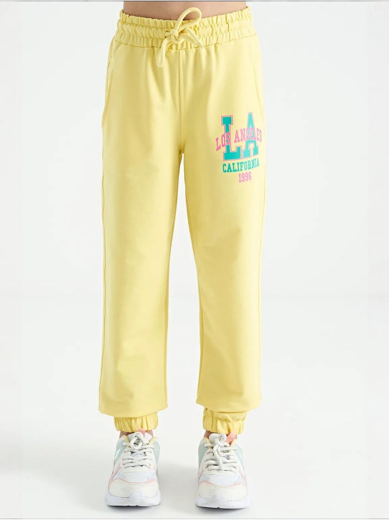 Calças youth em mistura de algodão tommy Amarelo-limão - Kiabi