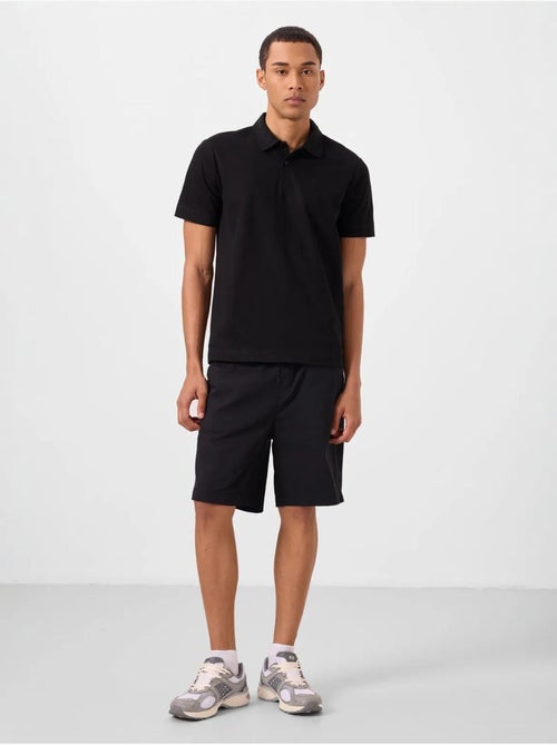 Calções chino de homem de corte regular tommy - Kiabi Calções chino de homem de corte regular tommy - Kiabi