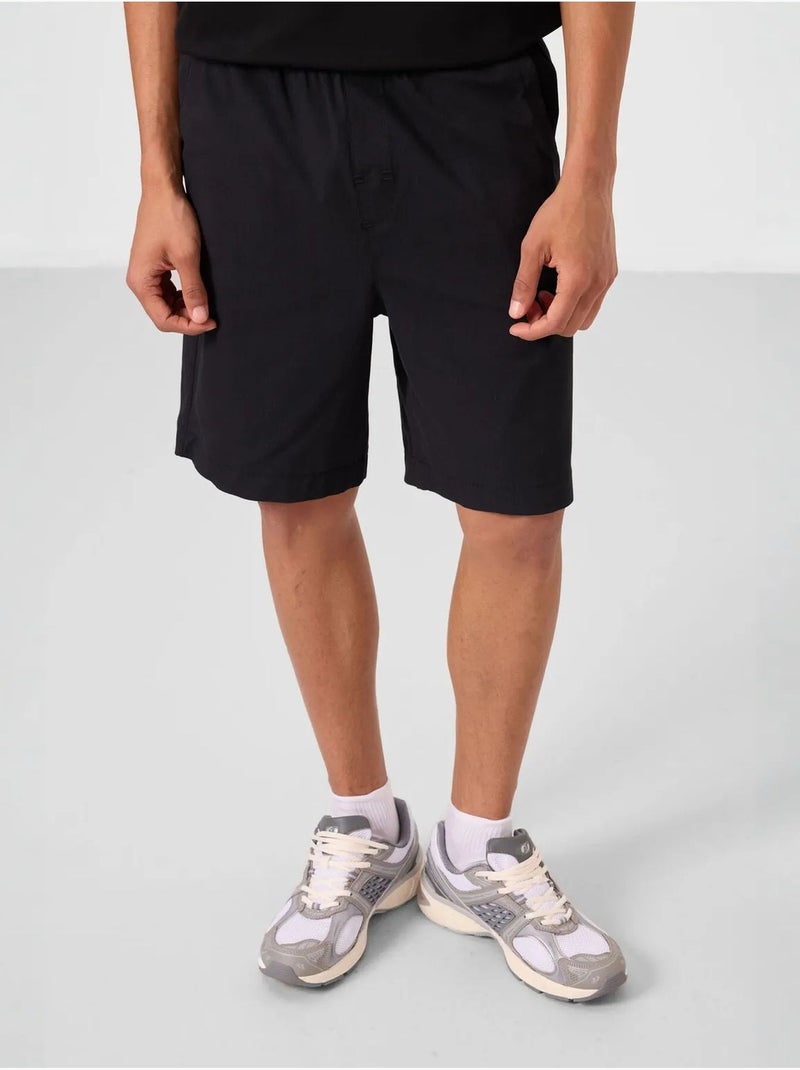 Calções chino de homem de corte regular tommy Preto - Kiabi