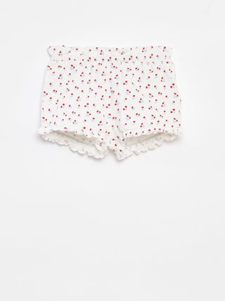 Calções com folhos e estampado