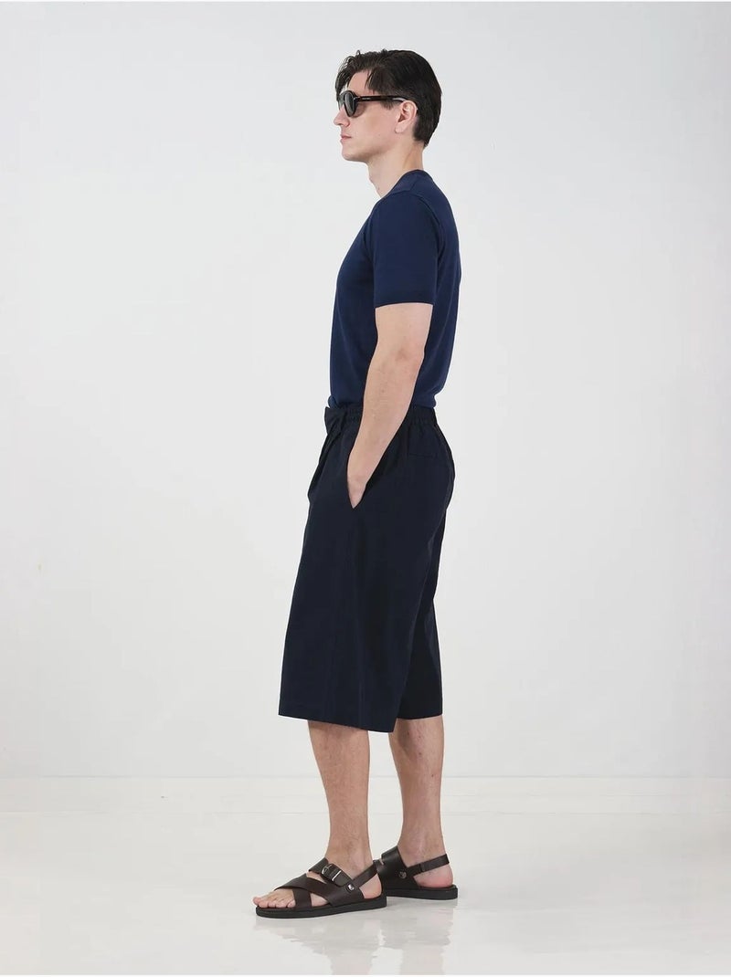 Calções compridos de perna larga estilo chino com cintura com cordão giesto Azul-marinho - Kiabi