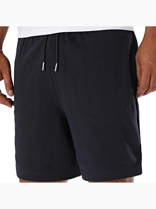 Calções de Banho Calvin Klein Jeans em Algodão para Homem - Kiabi Calções de Banho Calvin Klein Jeans em Algodão para Homem - Kiabi