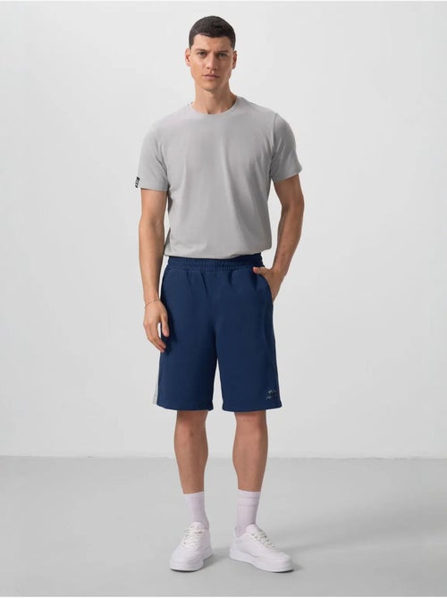 Calções de malha oversize em mistura de algodão tommy - Kiabi Calções de malha oversize em mistura de algodão tommy - Kiabi