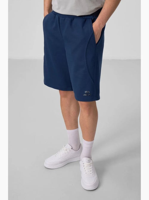 Calções de malha oversize em mistura de algodão tommy - Kiabi Calções de malha oversize em mistura de algodão tommy - Kiabi