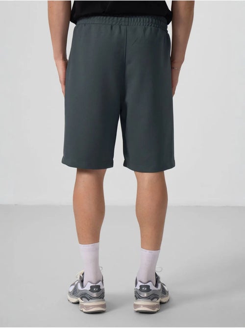 Calções de malha oversize em mistura de algodão tommy - Kiabi Calções de malha oversize em mistura de algodão tommy - Kiabi