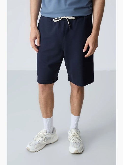 Calções de moletom masculinos em mistura de algodão tommy - Kiabi Calções de moletom masculinos em mistura de algodão tommy - Kiabi