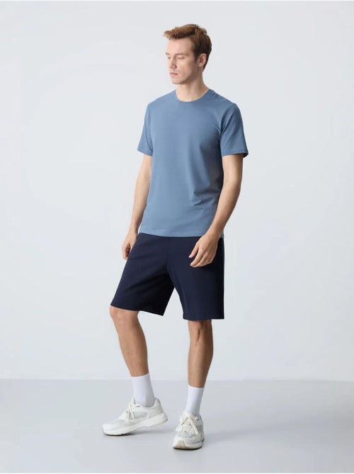 Calções de moletom masculinos em mistura de algodão tommy - Kiabi Calções de moletom masculinos em mistura de algodão tommy - Kiabi