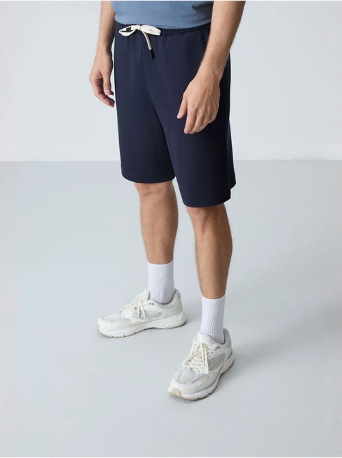 Calções de moletom masculinos em mistura de algodão tommy - Kiabi Calções de moletom masculinos em mistura de algodão tommy - Kiabi