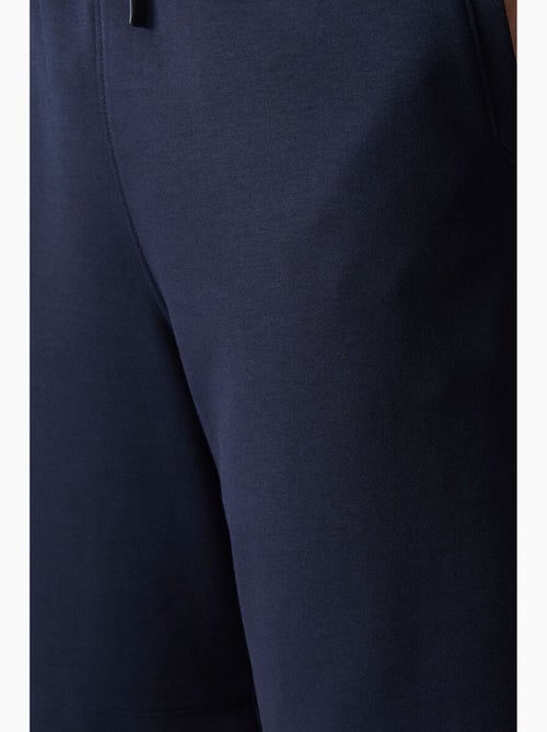 Calções de moletom masculinos em mistura de algodão tommy - Kiabi Calções de moletom masculinos em mistura de algodão tommy - Kiabi