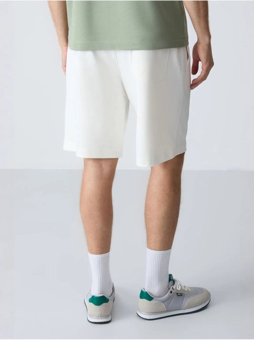 Calções de moletom masculinos em mistura de algodão tommy - Kiabi Calções de moletom masculinos em mistura de algodão tommy - Kiabi