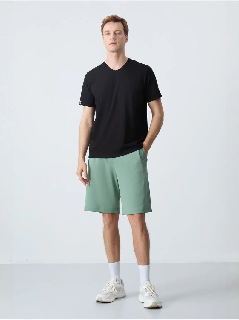 Calções de moletom masculinos em mistura de algodão tommy Verde menta - Kiabi