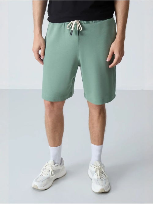 Calções de moletom masculinos em mistura de algodão tommy - Kiabi Calções de moletom masculinos em mistura de algodão tommy - Kiabi